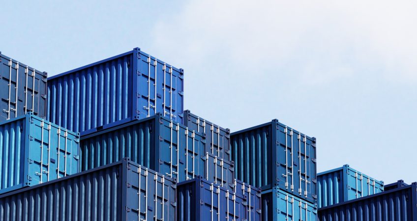 Industrial M&A, stack of blue storage containers